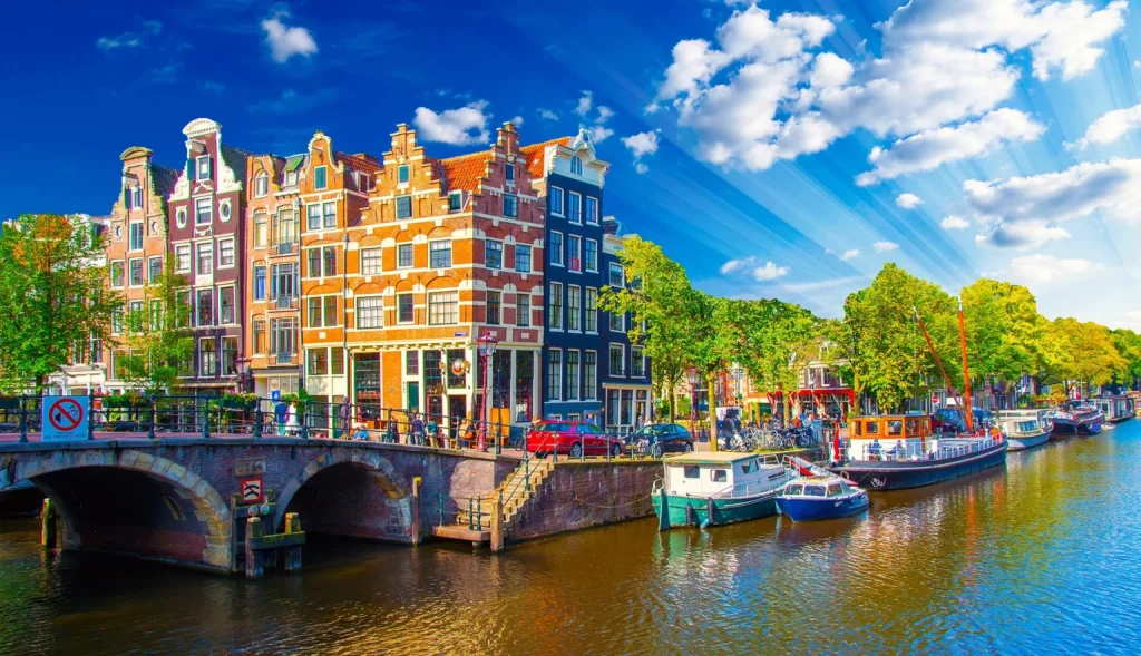 Amsterdam, the Netherlands’ capital, is famous for its canals, museums, cycling culture, and vibrant blend of history, art, and modern living.