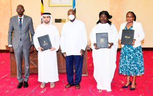Group of officials standing together during the signing ceremony for Uganda oil refinery investment partnership with a UAE delegation.