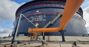 A massive 60,000,000-litre gasoline storage tank at the Dangote facility, illustrating the strategic milestone of Dangote starting upstream production in Nigeria's Niger Delta