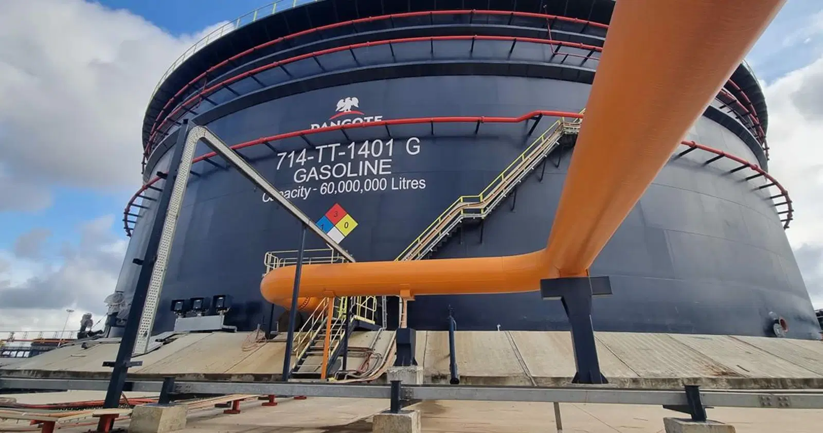 A massive 60,000,000-litre gasoline storage tank at the Dangote facility, illustrating the strategic milestone of Dangote starting upstream production in Nigeria's Niger Delta