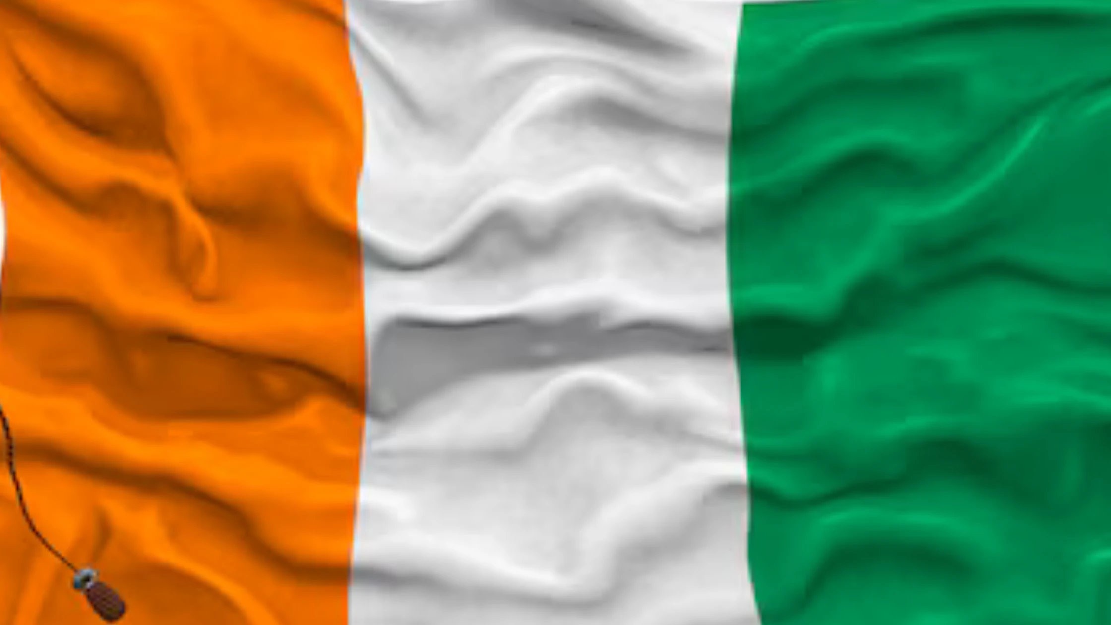 The flag of Côte d'Ivoire waving, symbolizing the regional market entry opportunities available to businesses who confirm that, yes, Can an EOR sponsor work permits in Ivory Coast? to legally mobilize their technical teams.