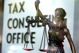 Lady Justice statue holding scales in front of a Tax Consulting Office sign, representing Tax Management Services in Nigeria Oil & Gas Fiscal Optimization Guide for 2026.