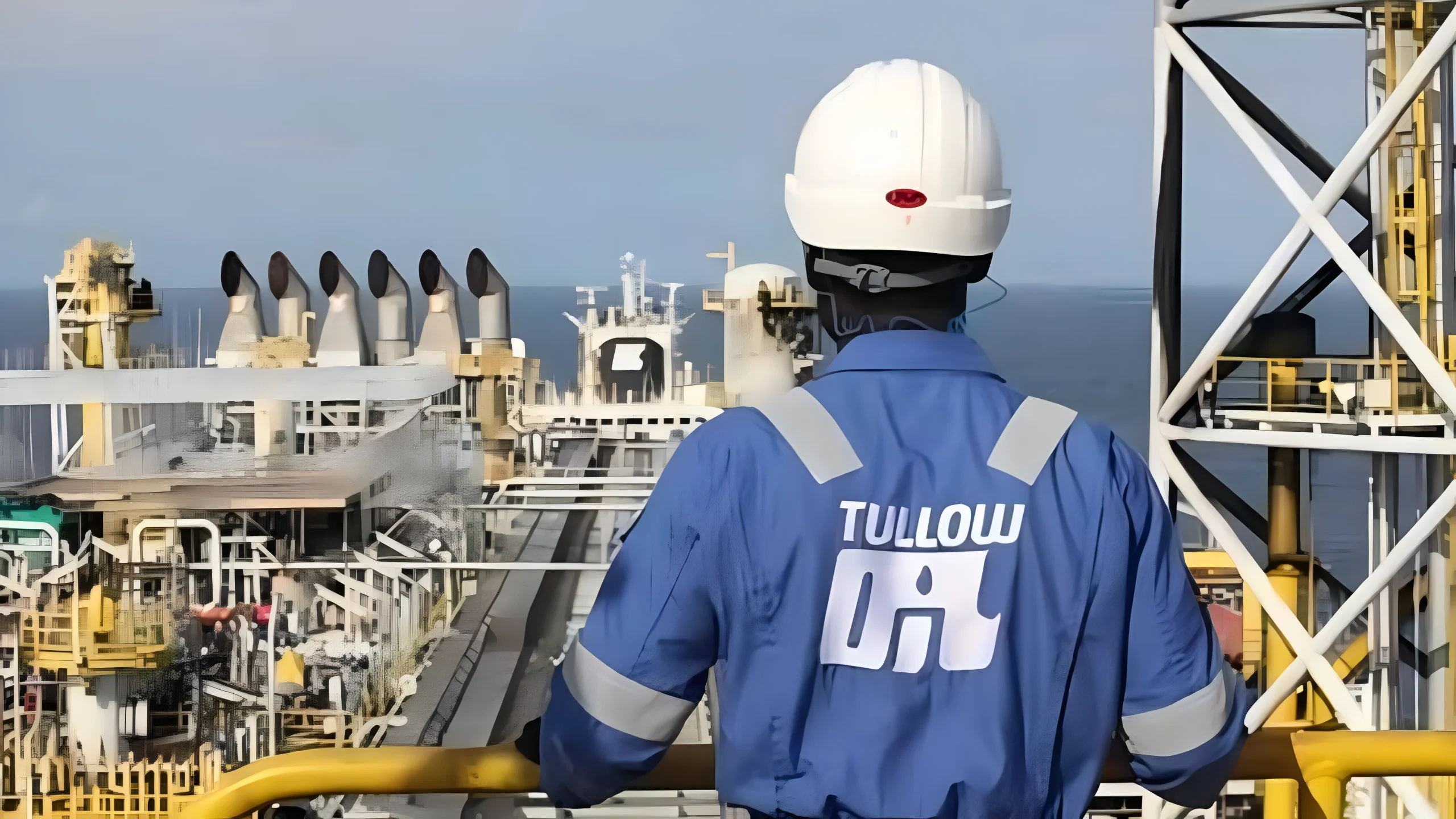 Tullow Oil worker on an offshore platform, symbolizing Ghana oil and gas tax compliance for multinational petroleum operators